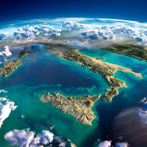 Highly detailed fragments of the planet Earth with exaggerated relief translucent ocean and clouds illuminated by the morning sun. Italy. Elements of this image furnished by NASA