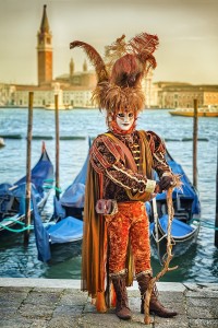VENICE, ITALY - FEBRUARY 27, 2014: Unidentified person with Venetian Carnival mask in Venice, Italy on February 2014. For only editorial